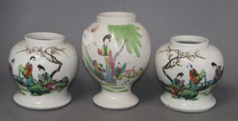 Three mid 20th century Chinese vasesCONDITION: The enamels on the larger vase are faded, all three