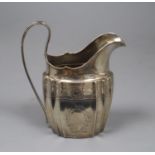 A George III Irish silver helmet shaped cream jug by Gustavus Byrne, Dublin, 1801, 13.3cm, 4.5 oz.