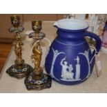 A pair of ormolu and enamel figural candlesticks and a Wedgwood jasperware jug