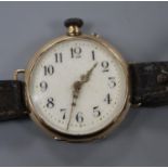 A lady's early 20th century 585 yellow metal manual wind wrist watch, on a leather strap.