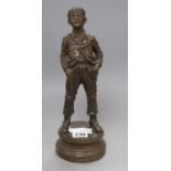 A bronze figure of a boy, 'Siffleur', with plaque titled Par Hertzberg, Exposition de 1889, height