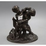 A bronze group of two fighting cherubs, height 23cm