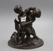 A bronze group of two fighting cherubs, height 23cm