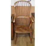 A 19th century ash and elm Windsor comb back armchairCONDITION: Faded appearance throughout, rear