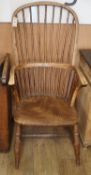 A 19th century ash and elm Windsor comb back armchairCONDITION: Faded appearance throughout, rear