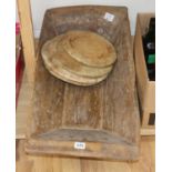 A Victorian wooden grain trough and four turned bread boards (5)