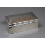 A George V silver mounted rectangular cigarette box, A & J Zimmerman, Birmingham, 1920, 16.3cm,