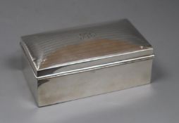 A George V silver mounted rectangular cigarette box, A & J Zimmerman, Birmingham, 1920, 16.3cm,