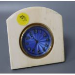 An ivory travelling clock with enamelled dial, height 9.5cm