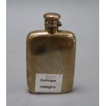 A sterling hip flask, with engraved monogram, 12.2cm, 3.5oz.CONDITION: Dented and scratched.