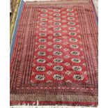 A Bokhara red ground rug, 180 x 132cm