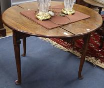 A mid 18th century walnut drop leaf table, W.140cm extended, D.104cm, H.71cm