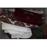 A collection of saddle bags, an Asian wedding dress, linen, etc.