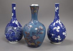 A pair of Chinese blue and white 'dragon' bottle vases and a Fukagawa enamelled blue ground vase,