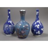 A pair of Chinese blue and white 'dragon' bottle vases and a Fukagawa enamelled blue ground vase,