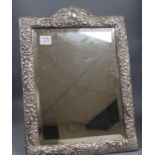 An Edwardian repousse silver mounted easel mirror by A & J Zimmerman, Birmingham, 1904, 55.6cm.