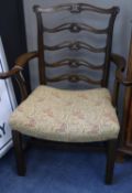 A pair of Georgian style mahogany open armchairs with ladderbacks