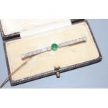 An early 20th century yellow metal, cabochon emerald and millegrain set diamond bar brooch, 52mm,