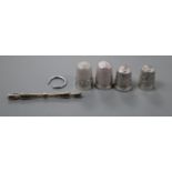 Four silver thimbles including two Charles Horner and a sterling and marcasite brooch.