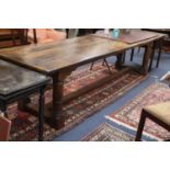 An oak and beech 18th century style refectory style dining table, L.296cm, W.86cm, H.75cm