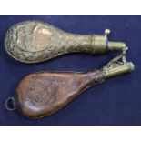 A Victorian brass mounted embossed copper powder flask and a nickel mounted leather shot flask (2)