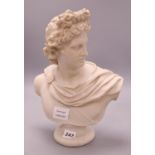 A resin 'marble' bust of Apollo, height 34cm