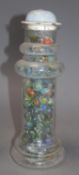 A Victorian glass vase, containing a collection of Victorian and later coloured marbles, height