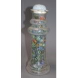 A Victorian glass vase, containing a collection of Victorian and later coloured marbles, height