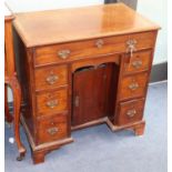 A George III mahogany kneehole desk, W.75cm., D.44cm., H.77cm.