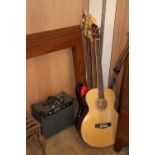 A Squier P-Bass guitar, a Harley Benton electric bass guitar, a Woodstock electro acoustic bass