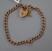 An early 20th century 9ct curblink bracelet with heart shaped clasp, gross 10.8 grams.