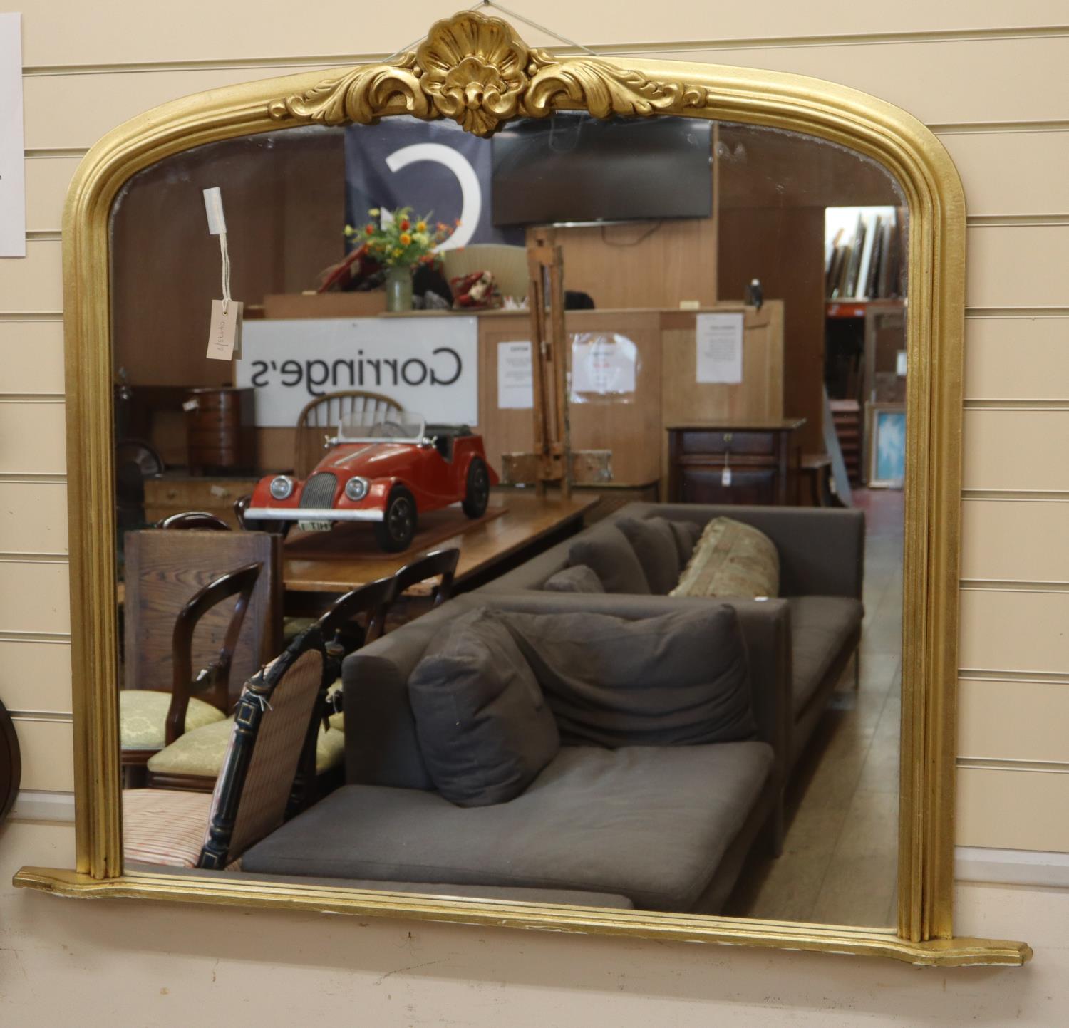 A Victorian style gilt framed overmantel mirror, W.124cm, H.105cm