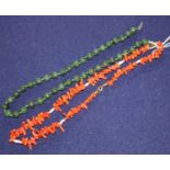 A coral necklace and a spinach green jade necklace