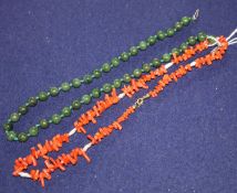 A coral necklace and a spinach green jade necklace