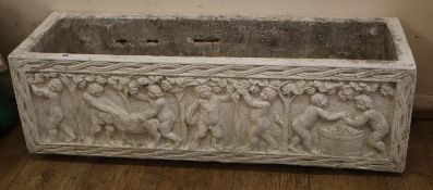 A rectangular reconstituted stone garden planter, decorated with bacchic cherubs, W.100cm, D.29cm,