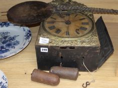 An early 19th century French wall clock, with an alabaster face and ebonised brass surround, above a