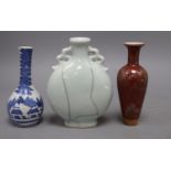 A Chinese moonflask, a blue and white vase and a sang de boeuf vase, tallest 17cm