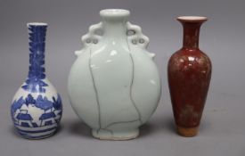 A Chinese moonflask, a blue and white vase and a sang de boeuf vase, tallest 17cm