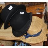 A straw boater and two bowler hats