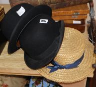 A straw boater and two bowler hats