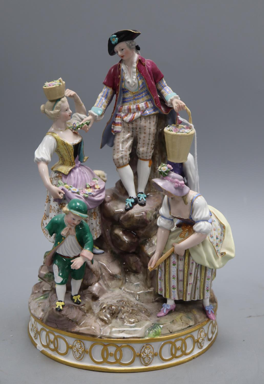 A 19th century Meissen gardening group, height 29cm, model D97CONDITION: Several breakages including