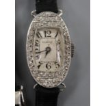 A lady's French 1930's/1940's white metal (inscribed Platine) and diamond set oval cocktail watch,