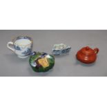 A group of Chinese porcelain including a Redware teapot, a blue and white tea cup and two other