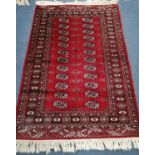 A Bokhara red ground rug, 145 x 100cm