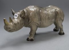 A Melba ware porcelain rhinoceros, height 20cm (a.f.), the broken end of horn is presentCONDITION: