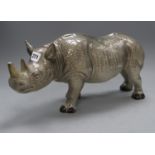 A Melba ware porcelain rhinoceros, height 20cm (a.f.), the broken end of horn is presentCONDITION: