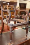 A Regency mahogany scroll elbow chair frame (no seat)