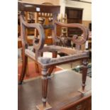 A Regency mahogany scroll elbow chair frame (no seat)