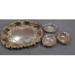A late Victorian repousse silver dish, London, 1899, 26cm and four smaller silver dishes, 10 oz.