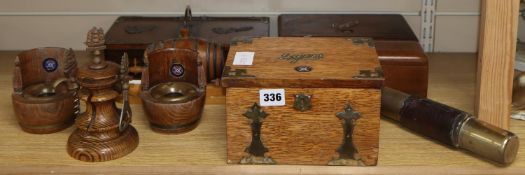 A collection of smoking and drinking paraphernalia including cigar boxes, ashtrays and bottle